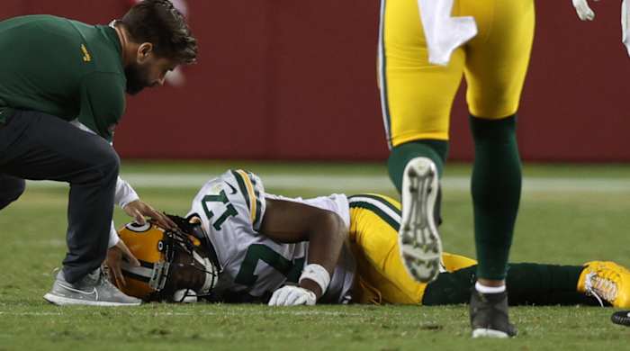 Davante Adams #17 of the Green Bay Packers is injured trying to catch a pass during the fourth quarter against the San Francisco 49ers in the game at Levi's Stadium on September 26, 2021 in Santa Clara, California.